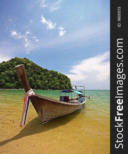 Longboat on beach in thailand