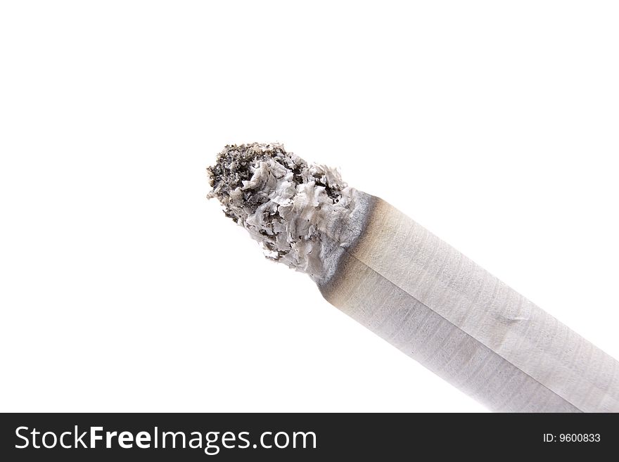 Burning cigarette on white ground