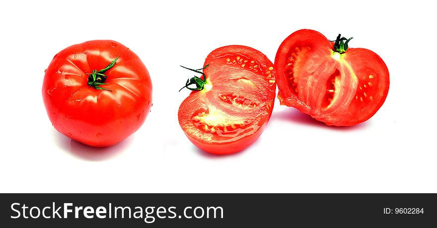 Whole and cuted tomato on the white background. Whole and cuted tomato on the white background.