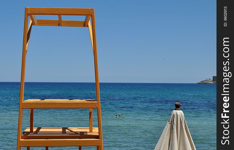 Yellow lifeguard tower on the beach in Cyprus