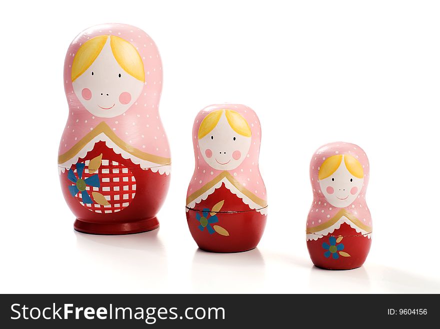 A Family of Three Russian Dolls that Split in Half