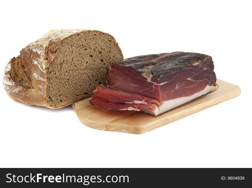 Smoked bacon on cutting board against a white background