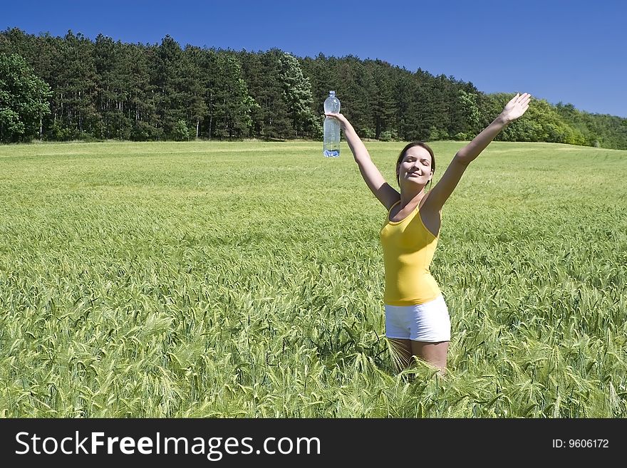 A beautiful woman feels happy on the field. A beautiful woman feels happy on the field.