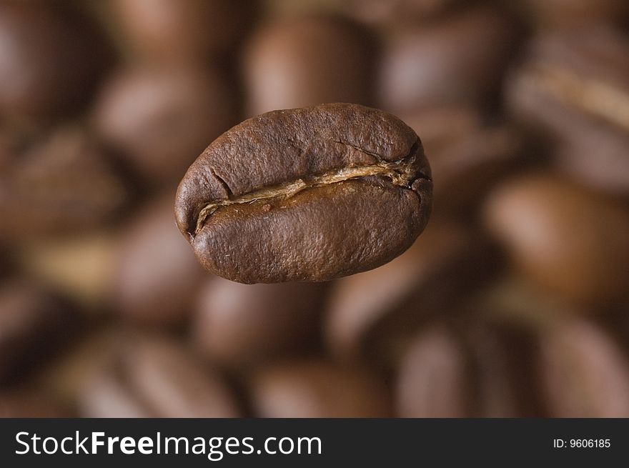 Coffee Bean close-up and Beans as background. Coffee Bean close-up and Beans as background