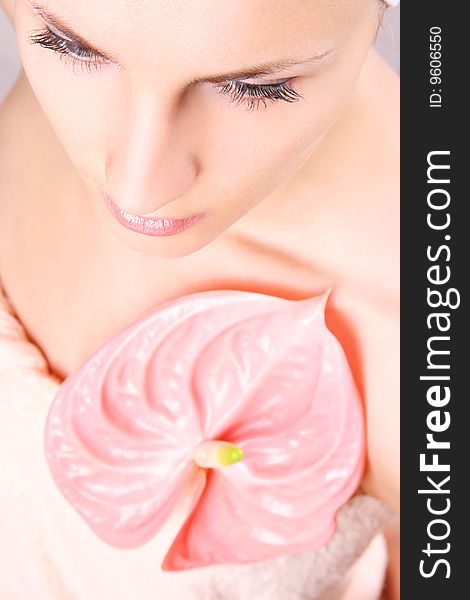 Young girl with pink flower