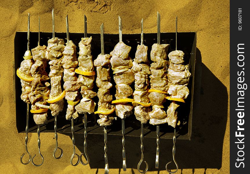 Shish kebab on skewers in a brazier