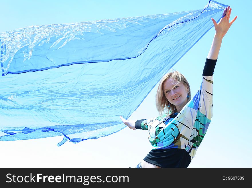 Beautiful young woman with blue skarf. Beautiful young woman with blue skarf