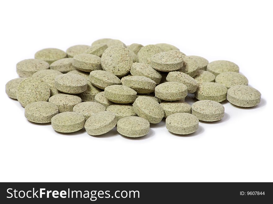 Green tablets isolated on a white background