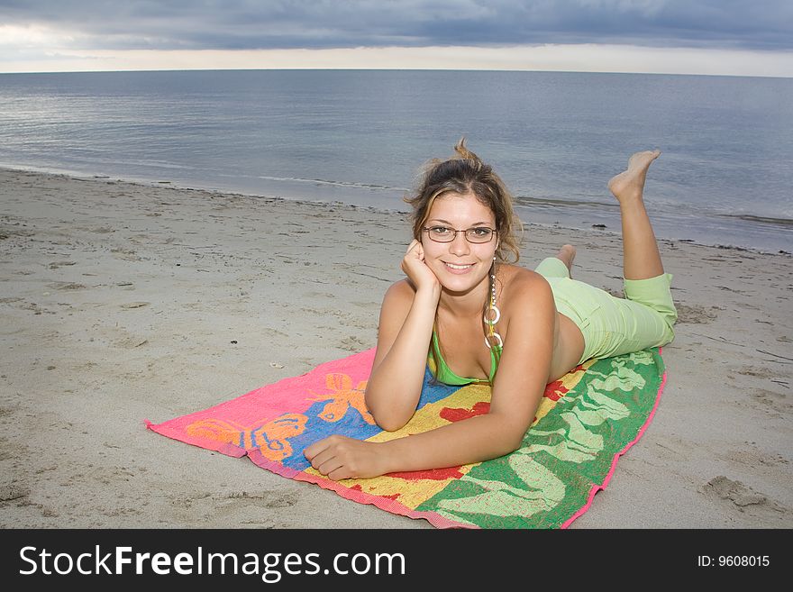 Beautiful Lady Smiling, Laying On A Towel (I)