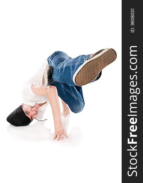 Young happy breakdancer standing on hands with a flying kick. Young happy breakdancer standing on hands with a flying kick