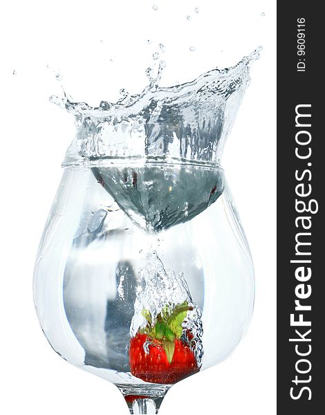 Strawberry inside goblet of splashing water isolated on white background with clipping path. Strawberry inside goblet of splashing water isolated on white background with clipping path