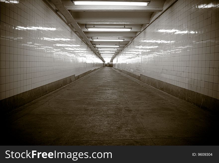 A tiled subway walkway at a Brooklyn subway station