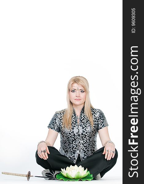 Woman meditating in lotus pose, isolated on white background