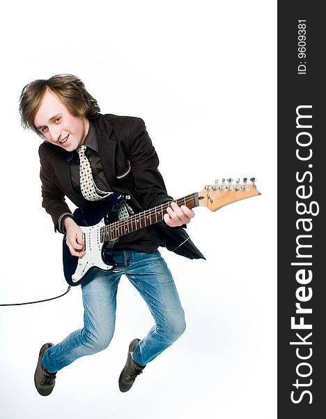 Young man playing electro guitar, motion blur