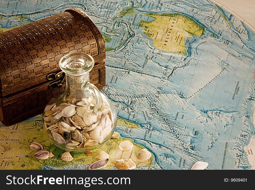 Wooden chest with jug and sea shells