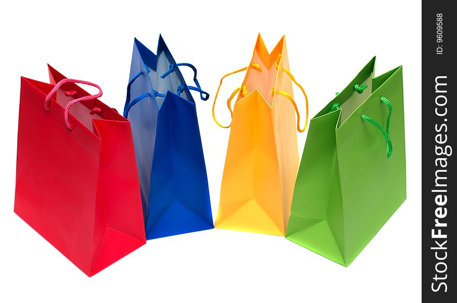 Multi-coloured packages for purchases are isolated on a white background. Multi-coloured packages for purchases are isolated on a white background