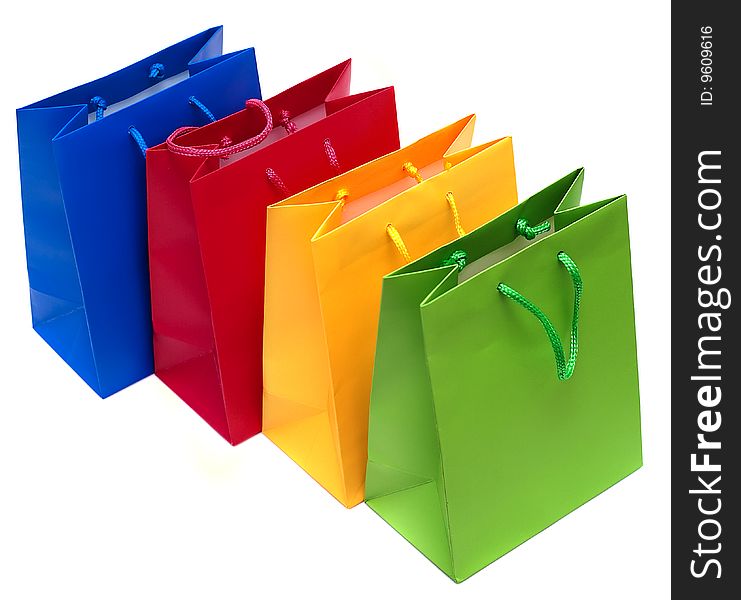 Multi-coloured packages for purchases are isolated on a white background. Multi-coloured packages for purchases are isolated on a white background