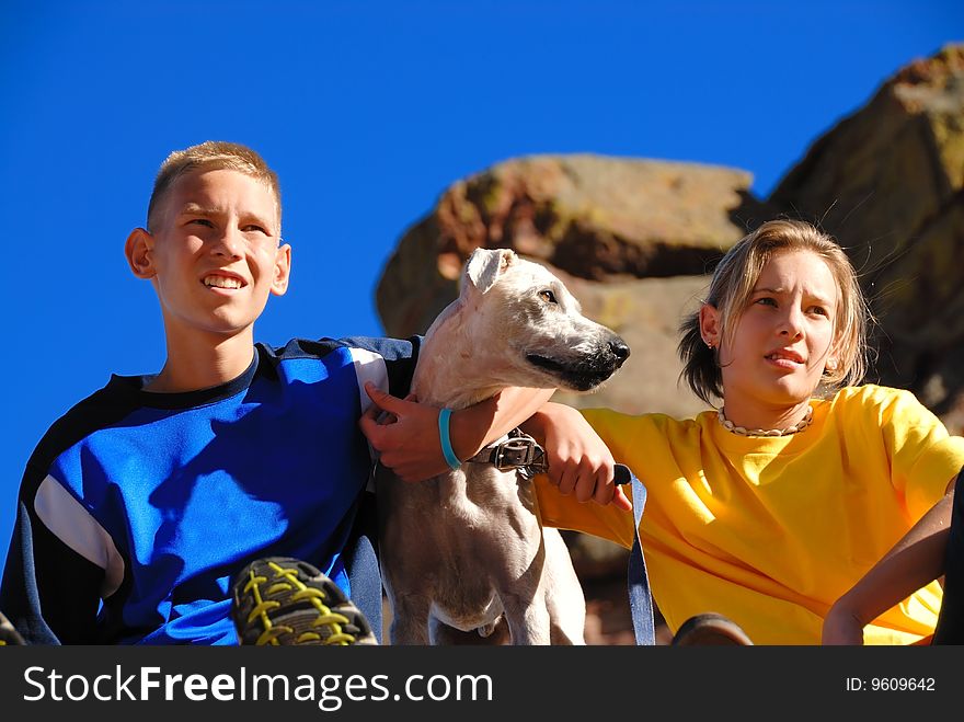 Brother and sister with their dog on a trip. Brother and sister with their dog on a trip