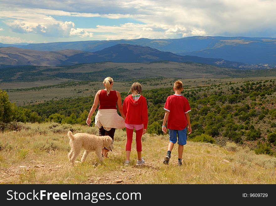 Family with dog on trip in Colorado Mountains. Family with dog on trip in Colorado Mountains.