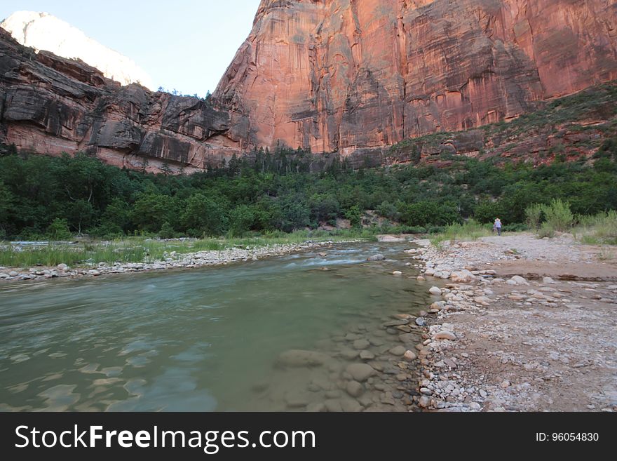 A river running in the bottom of a canyon. A river running in the bottom of a canyon.