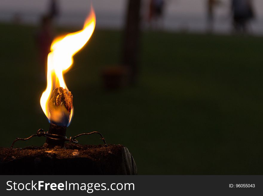 Close up of flame burning on match or candle. Close up of flame burning on match or candle.