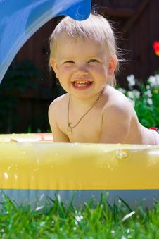 Little Girl In Yellow Pool Royalty Free Stock Image