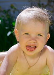Little Girl In Yellow Pool Stock Images