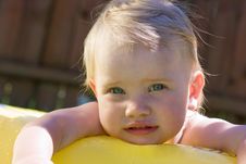 Little Girl In Yellow Pool Stock Photo