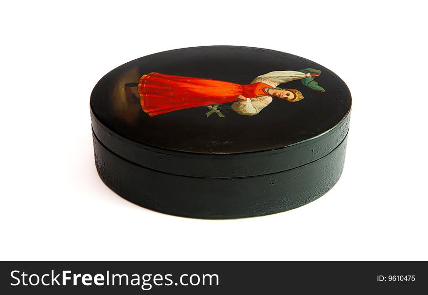 Oval lacquered black Russian casket painted with dancing female peasant isolated. Oval lacquered black Russian casket painted with dancing female peasant isolated