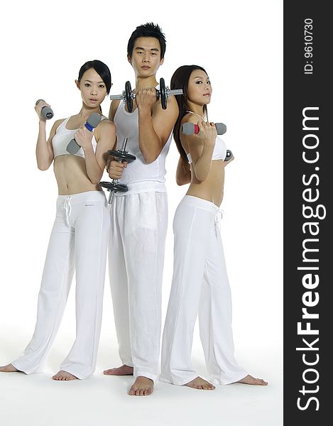 Group of people doing fitness exercise with dumbbells