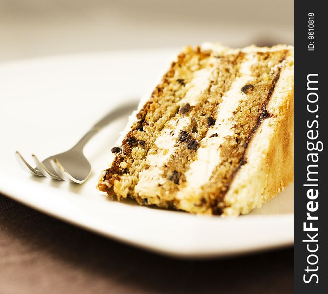 Cream cake with fork on a plate. Cream cake with fork on a plate