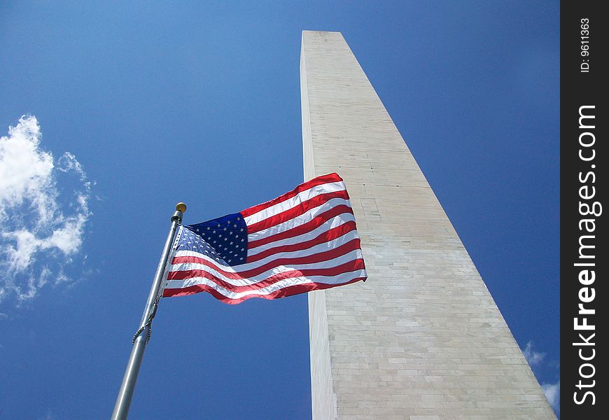 The American Flag flying in front of the Washington Monument.