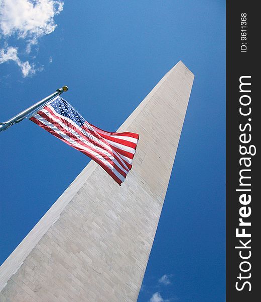 The American Flag flying in front of the Washington Monument.