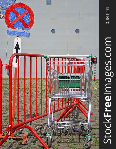 No parking sign with a parked (abandoned) and empty shopping cart :-)