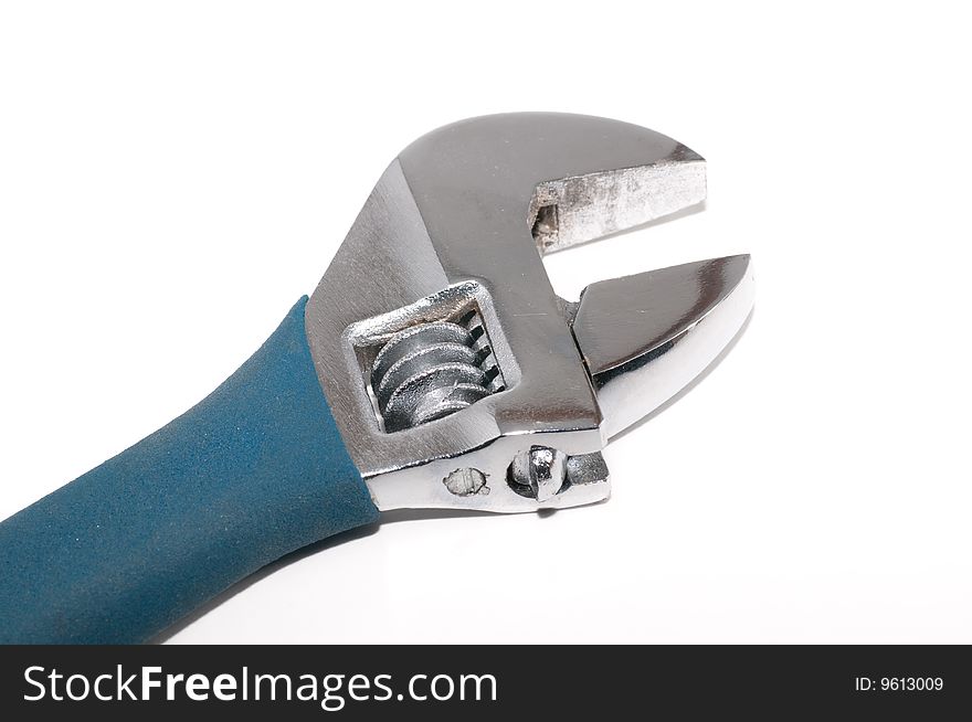 A studio shot of a wrench tool isolated against a white background. A studio shot of a wrench tool isolated against a white background