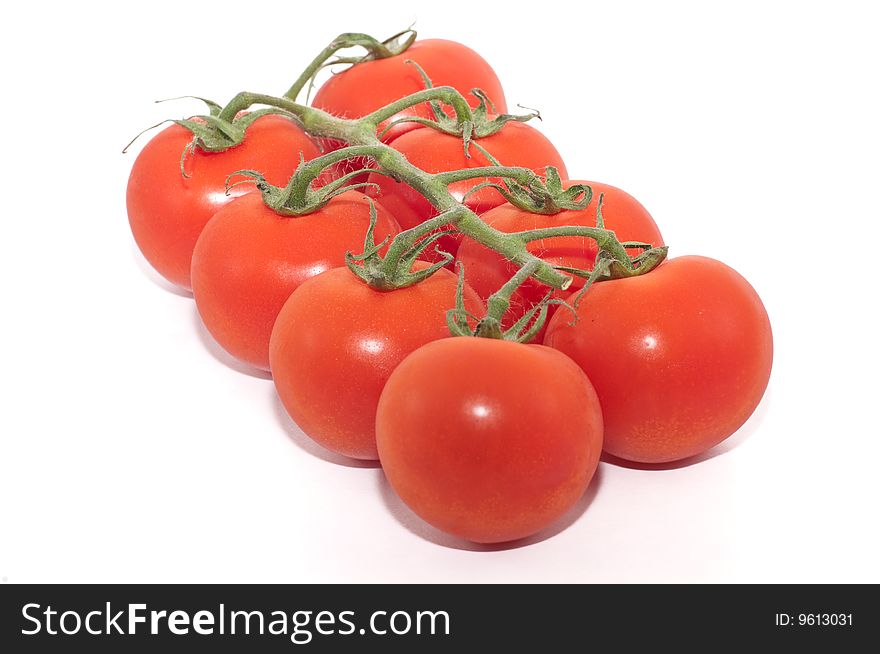 A cluster of cherry tomatoes isolated against a white background