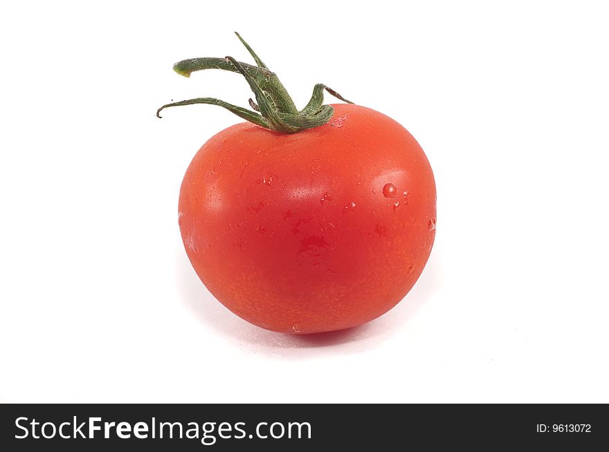 A cherry tomato isolated against a white background