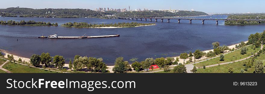 Panorama of Kiev and the river Dnepr with the barge