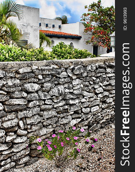 Typical caribbean wall with decorative flowers and trees. Typical caribbean wall with decorative flowers and trees.