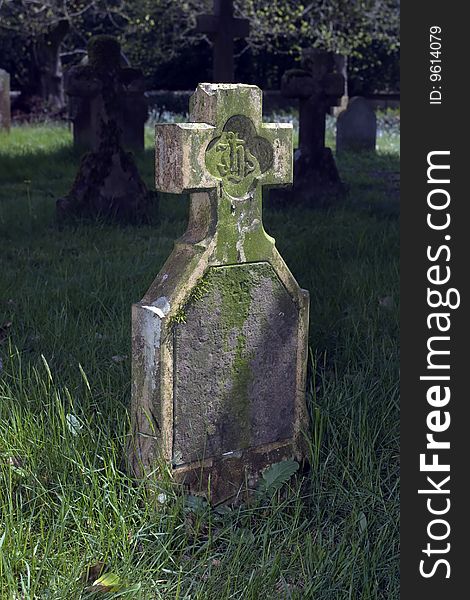 Old gravestone in English country churchyard