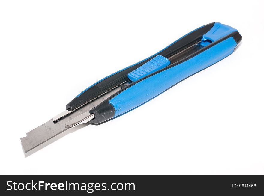 A photography of a utility knife, isolated on a white background, with its blade out. A photography of a utility knife, isolated on a white background, with its blade out.