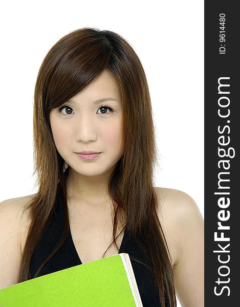 Female student portrait smiling and holding a green notebook. Female student portrait smiling and holding a green notebook