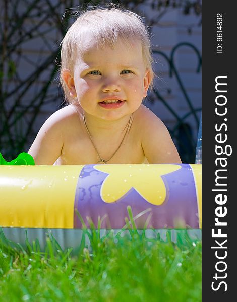 Little girl in yellow pool