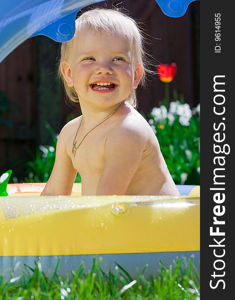 Little girl in yellow pool