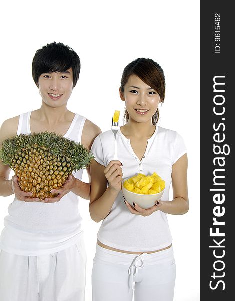 Couple eating and hold pineapple. Couple eating and hold pineapple