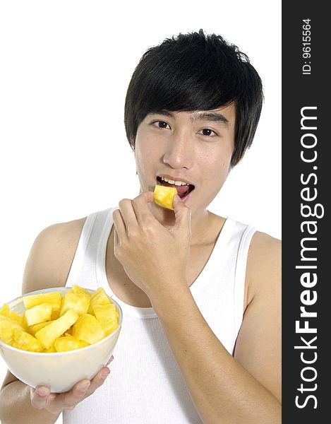 Young asian man eating and hold pineapple. Young asian man eating and hold pineapple