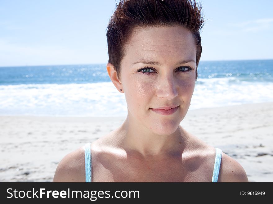 Beautiful Brunette looks at the beach