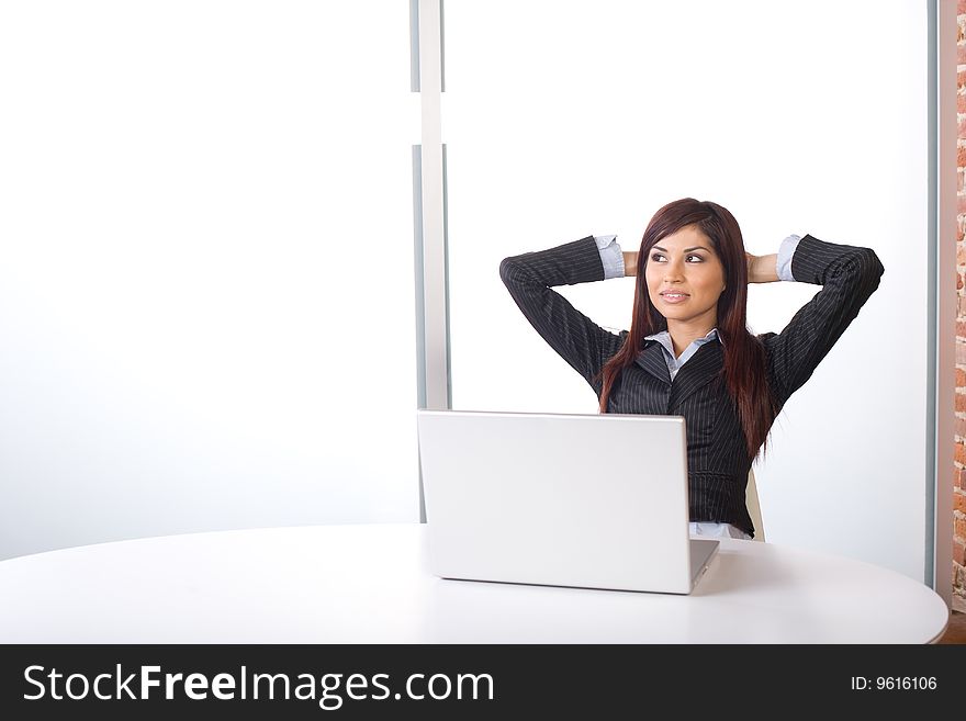 Business woman relaxing in a modern office