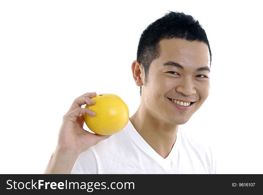 Young man holding grapefruit on white. Young man holding grapefruit on white