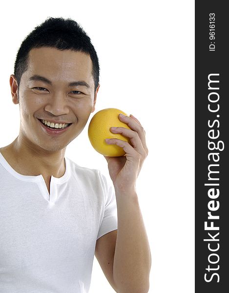 Young man holding grapefruit on white. Young man holding grapefruit on white